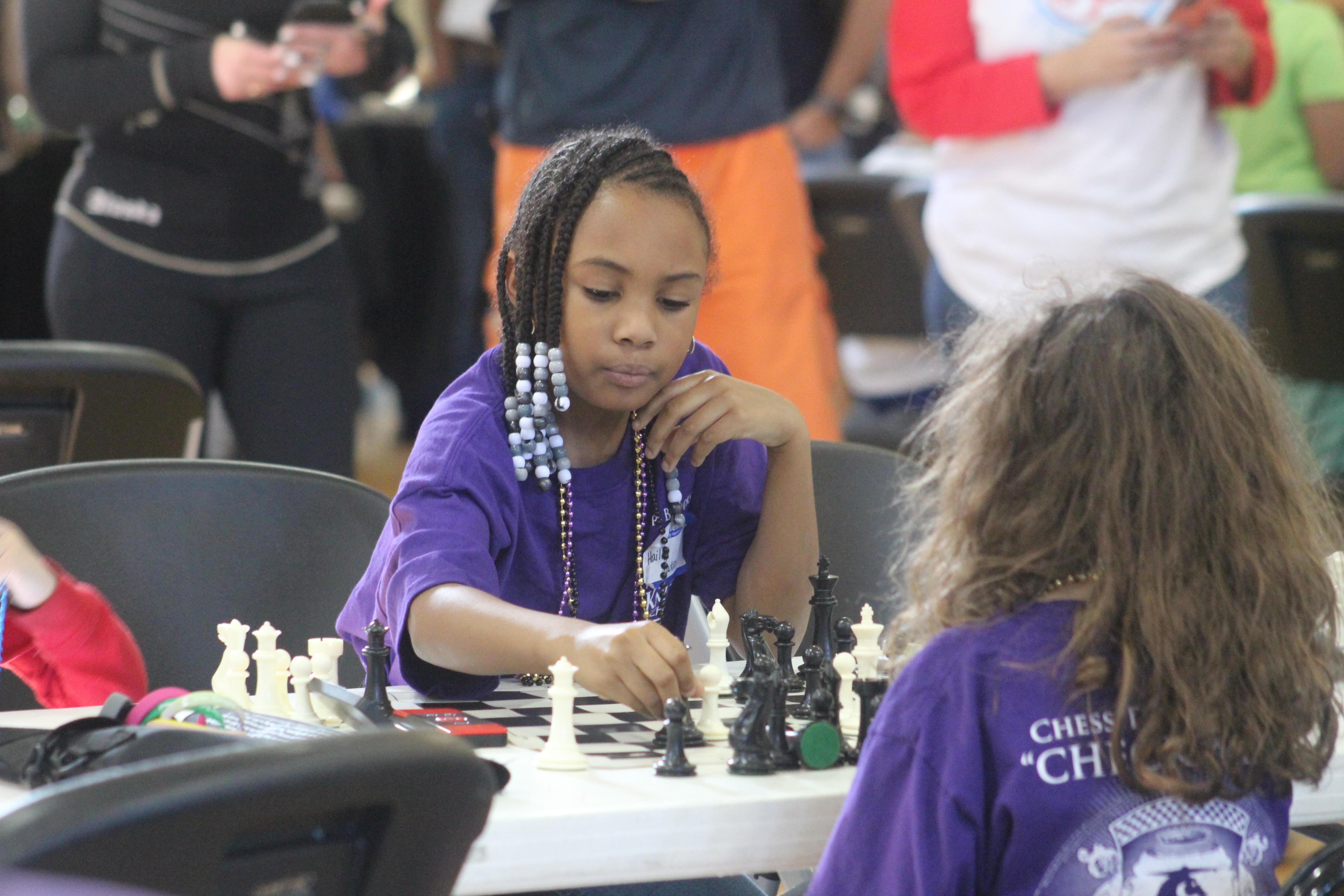 Focused chess player making a move