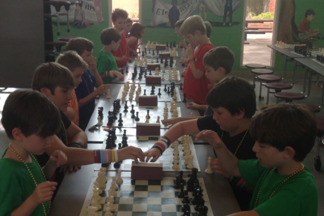 Kids playing chess at camp
